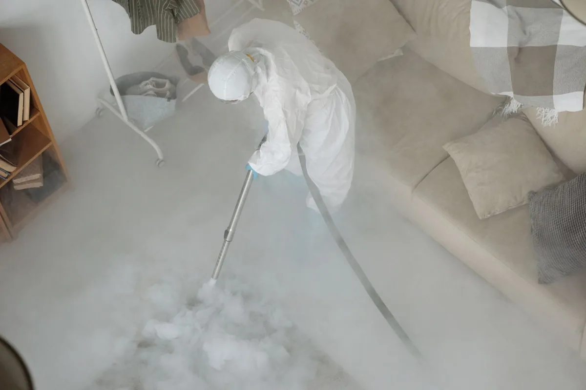 Biohazard cleanup technician in protective equipment, Southeast Village, Sacramento, CA